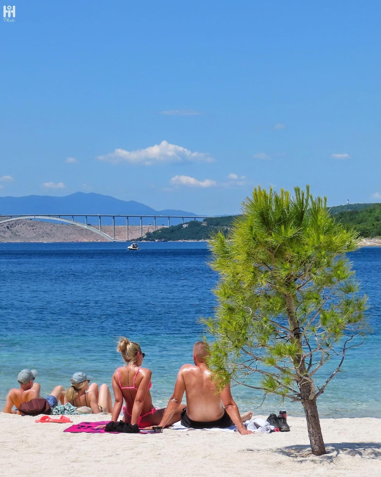 Beach near Crikvenica with the Krk bridge in the distance