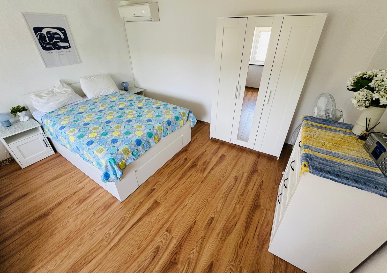 Bright bedroom with new wardrobes